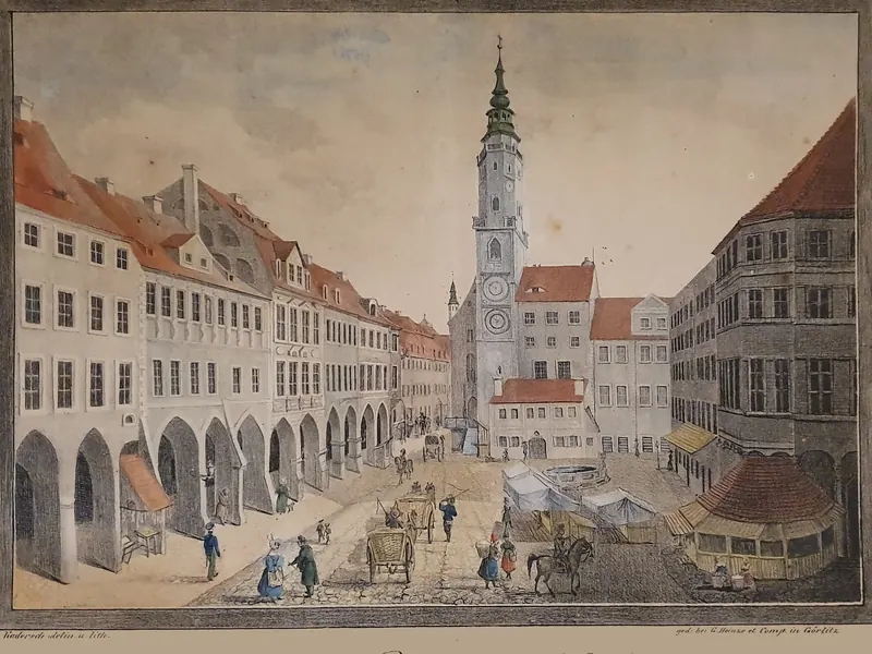 Litografia colorata del 1835 circa: l’Untermarkt con la torre del municipio, la casa già con la nuova facciata.
